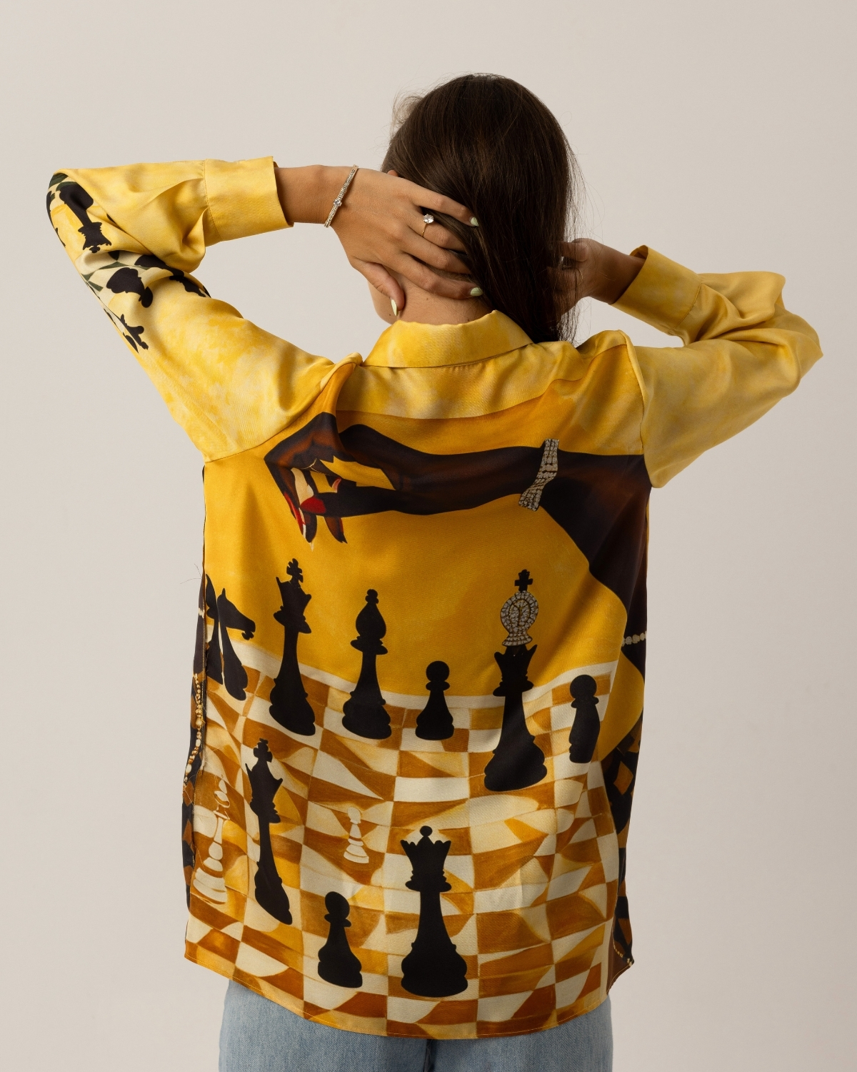 Checkmate Gold Shirt About Us