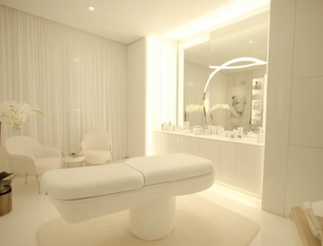 Luxury Spa Room with White Interior and Massage Table